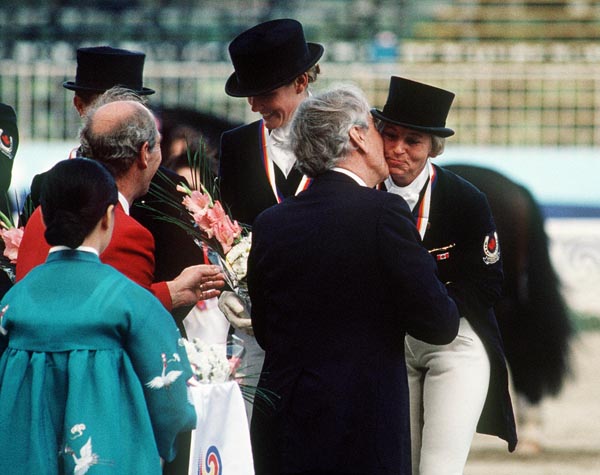(Left to right) Canada's Ashley Nicoll and Eva-Maria Pracht celebrate their bronze medal win in the equestrian-dressage event at the 1988 Olympic games in Seoul. (CP PHOTO/ COA/ C. McNeil)