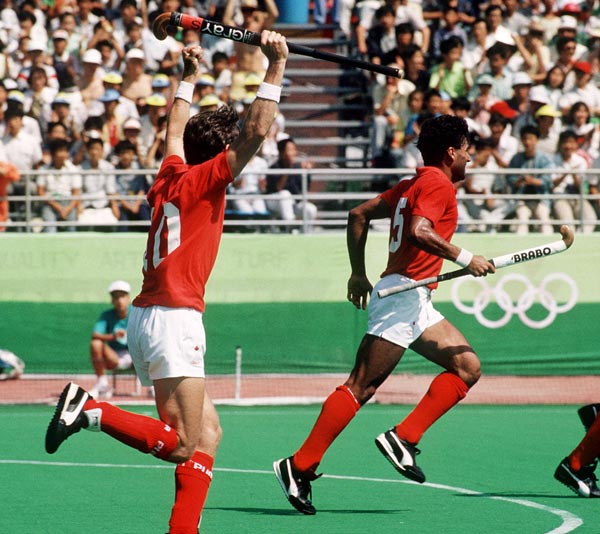 Canada's Trevor Porritt (left) and Satinder Chohan play field hockey at the 1988 Seoul Olympic Games. (CP Photo/ COA/ T. Grant)