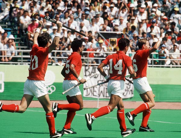 Canada's Trevor Porritt (#10), Satinder Chohan (#5), Pasquale Caruso (#14) and Christopher Gifford (#6) celebrate during field hockey action at the 1988 Seoul Olympic Games. (CP Photo/ COA/ T. Grant)