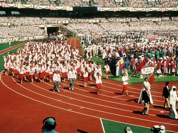 Canadian Olympic athletes participate in the opening ceremonies of the 1988 Olympic games in Seoul. (CP PHOTO/ COA/ Cromby McNeil)