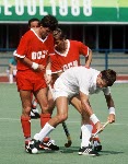 Canada's Ross Rutledge (left) and Pat Burrows (centre) play field hockey at the 1988 Seoul Olympic Games. (CP Photo/ COA/ T. Grant)
