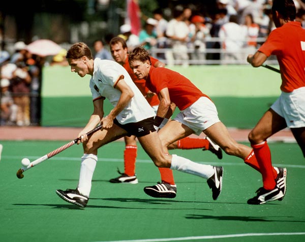 Canada's Pat Burrows (centre) plays field hockey at the 1988 Seoul Olympic Games. (CP Photo/ COA/ T. Grant)