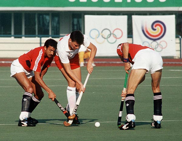 Canada's Ian Bird (centre) plays field hockey at the 1988 Seoul Olympic Games. (CP Photo/ COA/ T. Grant)