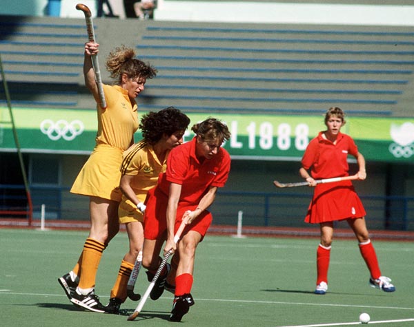Canada's Sharon Creelman (centre) and Michelle Conn (right) play field hockey at the 1988 Seoul Olympic Games. (CP Photo/ COA/ T. Grant)