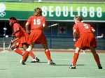 Canada's Terry Wheatly (left) and Laura Branchaud (centre) play field hockey at the 1984 Los Angeles Olympic Games. (CP Photo/ COA/ Ted Grant)