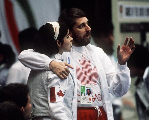 Canada's Jacynthe Poirier (left) and Manuel Guittet talk during the fencing event at the 1988 Olympic games in Seoul. (CP PHOTO/ COA/ F.S.G.)