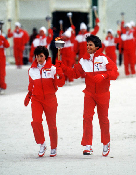 Canada's Cathy Preistner and Ken Read run with the olympic flame during the opening ceremonies of the 1988 Winter Olympics in Calgary. (CP PHOTO/COA/ T. O'lett)