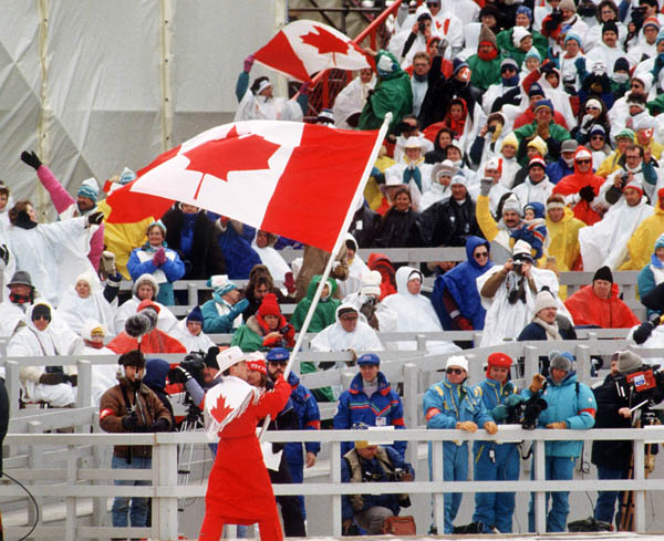 Canada's Brian Orser carries the Canadian flag during the opening ceremonies of the 1988 Winter Olympics in Calgary. (CP PHOTO/COA)
