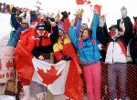 A fan waves a flag from the crowd of on-lookers at the 1998 Nagano Winter Olympics. (CP PHOTO/COA)