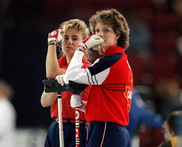 Canada's Penny Ryan and Debbie Jones (left) compete in the curling event at the 1988 Calgary Olympic winter Games. (CP PHOTO/COA/Ted Grant)