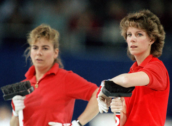 Canada's Penny Ryan and Debbie Jones (left) compete in the curling event at the 1988 Calgary Olympic winter Games. (CP PHOTO/COA/Ted Grant)