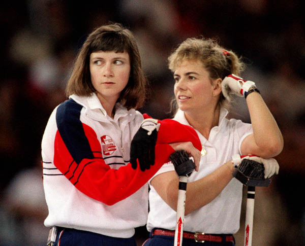 Canada's Linda Moore and Debbie Jones compete in the curling event at the 1988 Calgary Olympic winter Games. (CP PHOTO/COA/Ted Grant)