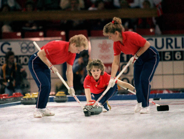 Canada's Lindsay Sparkes, Penny Ryan and Debbie Jones compete in the curling event at the 1988 Calgary Olympic winter Games. (CP PHOTO/COA/Ted Grant)