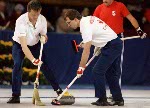 (From left to right) Canada's Edward Lukowich, Neil Houston and Brent Syme compete in the curling event at the 1988 Calgary Olympic winter Games. (CP PHOTO/COA/Ted Grant)