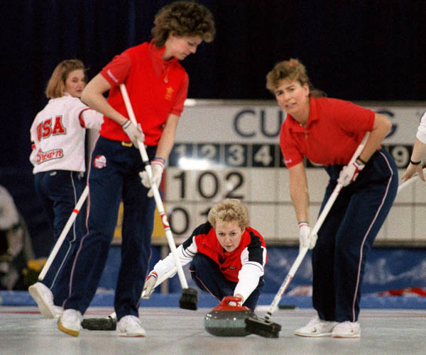 (From left) Canada's Penny Ryan, Lindsay Sparkes and Debbie Jones compete in the curling event at the 1988 Calgary Olympic winter Games. (CP PHOTO/COA/Ted Grant)