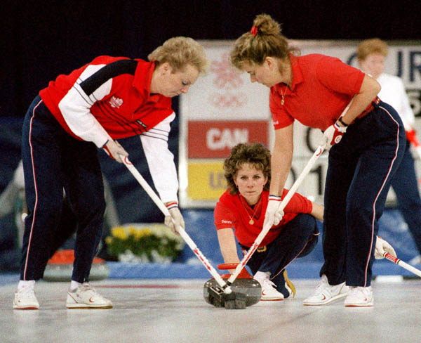 (From left) Canada's Lindsay Sparkes, Penny Ryan and Debbie Jones compete in the curling event at the 1988 Calgary Olympic winter Games. (CP PHOTO/COA/Ted Grant)