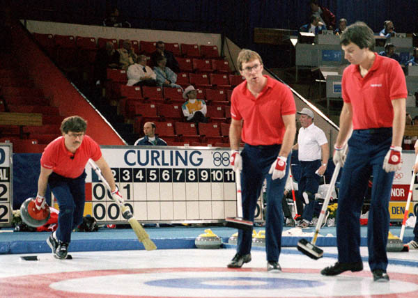 (From left to right) Canada's Edward Lukowich, Neil Houston and Brent Syme compete in the curling event at the 1988 Calgary Olympic winter Games. (CP PHOTO/COA/Ted Grant)