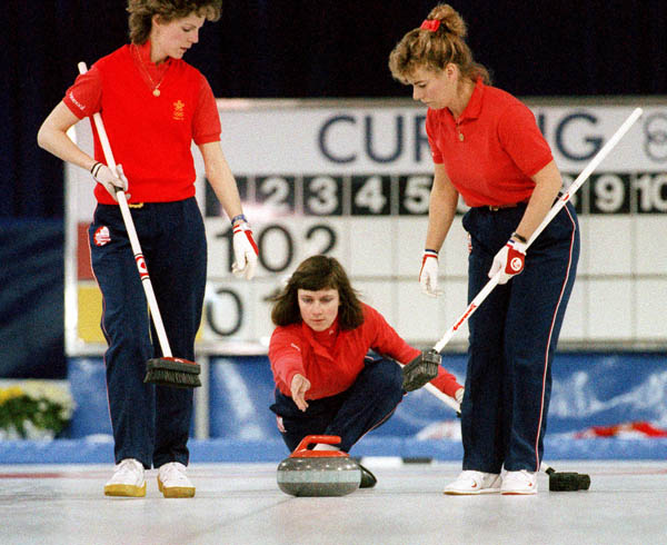 (From left to right) Canada's Penny Ryan, Linda Moore, and Debbie Jones compete in the curling event at the 1988 Calgary Olympic winter Games. (CP PHOTO/COA/Ted Grant)