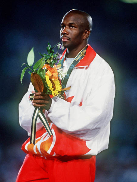 Canada's Donovan Bailey celebrates the gold medal won in the men's 100m at the 1996 Atlanta Summer Olympic Games. (CP PHOTO/COA/Claus Andersen)