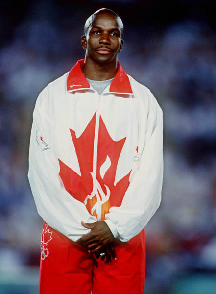 Canada's Donovan Bailey celebrates the gold medal won in the men's 100m at the 1996 Atlanta Summer Olympic Games. (CP PHOTO/COA/Claus Andersen)