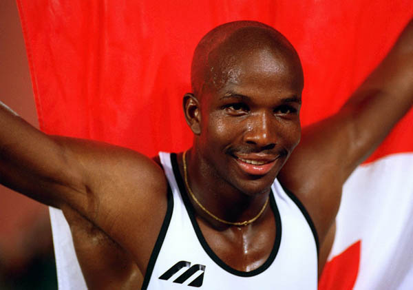 Canada's Donovan Bailey celebrates the gold medal won in the men's 100m at the 1996 Atlanta Summer Olympic Games. (CP PHOTO/COA/Claus Andersen)