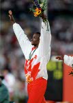 Canada's Donovan Bailey celebrates the gold medal won in the men's 100m at the 1996 Atlanta Summer Olympic Games. (CP PHOTO/COA/Claus Andersen)