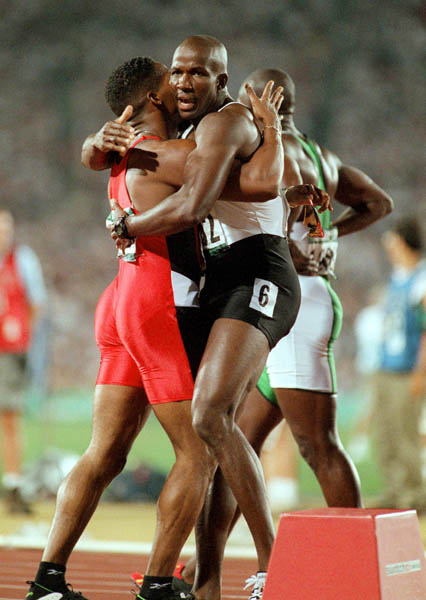 Canada's Donovan Bailey celebrates the gold medal won in the men's 100m at the 1996 Atlanta Summer Olympic Games. (CP PHOTO/COA/Claus Andersen)