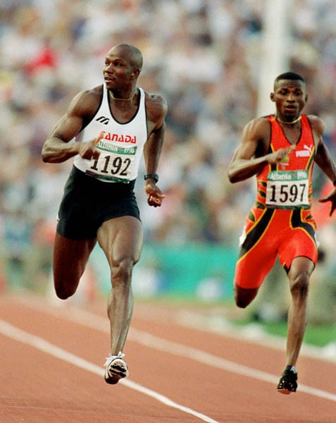 Canada's Donovan Bailey (left) competes in the men's 100m event at the 1996 Atlanta Summer Olympic Games. (CP PHOTO/COA/Claus Andersen)