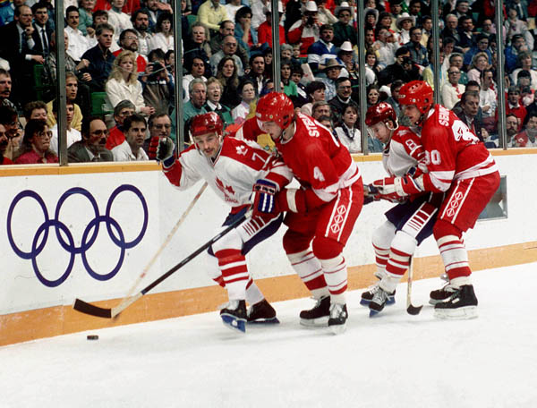 Canada's Wallace Schreiber (#7) and Brian Bradley (#8) participating in the hockey event at the 1988 Winter Olympics in Calgary. (CP PHOTO/ COA/ S.Grant)