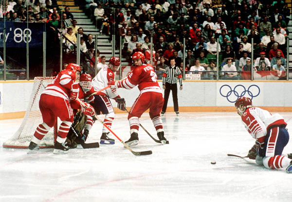 Canada's Brian Bradley (#8) and Wallace Schreiber (#7) participate in the hockey event at the 1988 Winter Olympics in Calgary. (CP PHOTO/ COA/ S.Grant)
