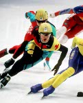 Canada's Frederic Blackburn (left) competes in the short track speed skating event at the 1992 Albertville Olympic winter Games. (CP PHOTO/COA/Ted Grant)