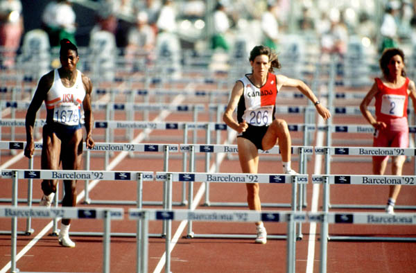 Canada's Catherine Bond-Mills (centre) competes in the heptathlon event at the 1992 Olympic games in Barcelona. (CP PHOTO/ COA/ Claus Andersen)
