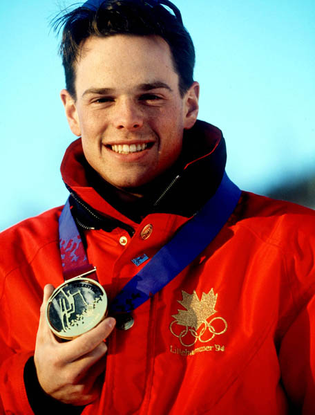 Canada's Jean-Luc Brassard celebrates after winning the gold medal in the men's freestyle ski areal event at the 1994 Lillehammer Winter Olympics. (CP PHOTO/ COA/ Claus Andersen)