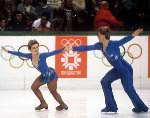 Canada's Paul Martini (left), Barbara Underhill and coach Louis Stong wait for scores during the figure skating-pairs event at the 1984 Sarajevo Olympic winter Games. (CP PHOTO/COA/Tim O'lett)