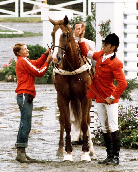 Canada's Michel Vaillancourt pats Branch County in an equestrian event at the 1976 Montreal Olympic games. (CP PHOTO/ COA/RW)