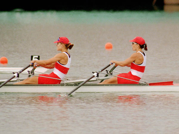 Canada's Kathleen Heddle (left) and Marnie McBean row their way to a gold medal in the womens 2x sculls event at the 1996 Atlanta Summer Olympic Games. (CP PHOTO/COA/Mike Ridewood)