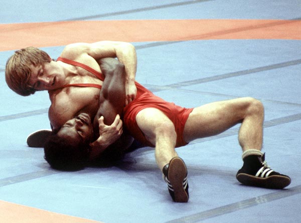 Canada's John McPhedran (red) competes in the wrestling event at the 1976 Olympic games in Montreal. (CP PHOTO/ COA/RW)