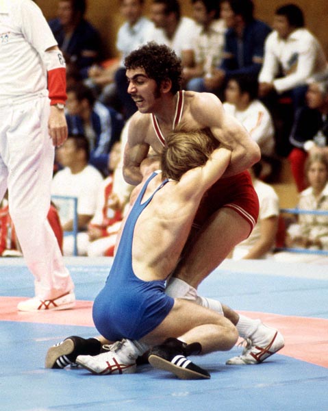 Canada's Howard Stupp (red) competes in a wrestling event at the 1976 Olympic games in Montreal. (CP PHOTO/ COA/RW)