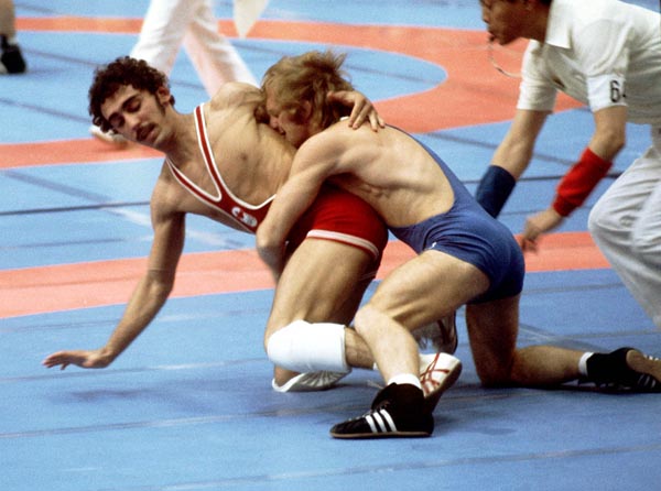 Canada's Howard Stupp (red) competes in a wrestling event at the 1976 Olympic games in Montreal. (CP PHOTO/ COA/RW)