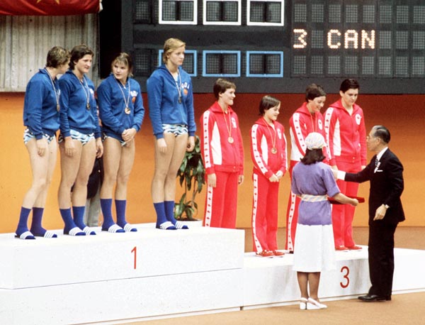 Canada's women relay team (right) celebrates their bronze medal win in the swimming event at the 1976 Olympic games in Montreal. (CP PHOTO/ COA/MB)