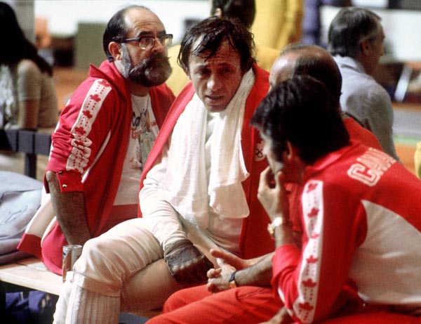 Canada's Peter Urban (centre) takes a break during  fencing action at the 1976 Olympic games in Montreal. (CP PHOTO/ COA/ BB)