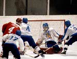 Canada's Doug Lidster (left) rounds the net during hockey action against Sweden at the 1984 Winter Olympics in Sarajevo. (CP PHOTO/ COA/O. Bierwagon )