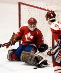 Canada's Patrick Flatley (26) and Mario Gosselin (goalie) compete during hockey action against Finland at the 1984 Winter Olympics in Sarajevo. (CP PHOTO/ COA/ O. Bierwagon)