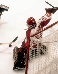 Canada's Mario Gosselin (goalie) keep his eyes on the puck during hockey action against Austria at the 1984 Winter Olympics in Sarajevo. (CP PHOTO/ COA/ O. Bierwagon)