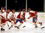 Canada's Patrick Flatley (centre) competes in hockey action against the United States at the 1984 Winter Olympics in Sarajevo. (CP PHOTO/ COA/O. Bierwagon )
