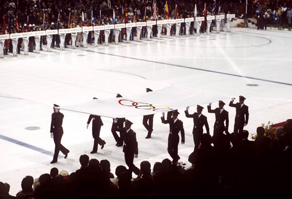 Honour guards carry the Olympic flag at the opening ceremonies at the 1984 Winter Olympics in Sarajevo. (CP PHOTO/COA/J. Merrithew )