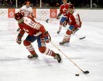 From left, Canada's Darren Lowe (14), James Patrick, Mario Gosselin (goalie) and Jean-Jacques Daigneault scramble to defend the crease during hockey action against the USSR at the 1984 Winter Olympics in Sarajevo. (CP PHOTO/ COA/O. Bierwagon )