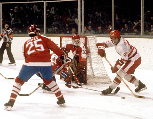 Canada's Bruce Driver (#25), Doug Lidster (hidden) and Mario Gosselin (goalie) compete in hockey action against the USSR at the 1984 Winter Olympics in Sarajevo. (CP PHOTO/ COA/O. Bierwagon )