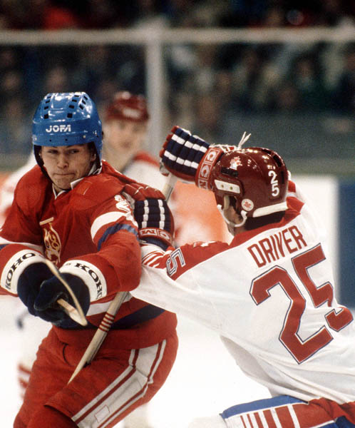 Canada's Bruce Driver (right) checks an opponent during hockey action against Czechoslovakia at the 1984 Winter Olympics in Sarajevo. (CP PHOTO/ COA/O. Bierwagon )