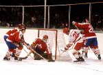 Canada's Mario Gosselin (centre) and Carey Wilson (right) try to stop Soviet player Aleksandr Gerasimov during hockey action against the USSR at the 1984 Winter Olympics in Sarajevo. (CP PHOTO/ COA/O. Bierwagon )